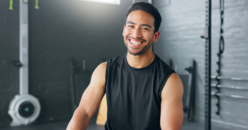 A man smiling in a gym for a workout A man smiling in a gym for a workout